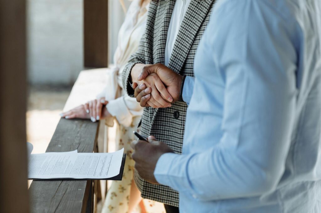 a broker and a client doing a handshake