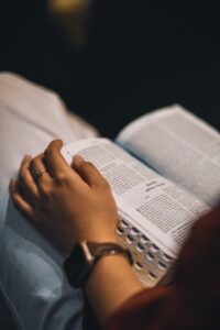 close up of a person reading a bible