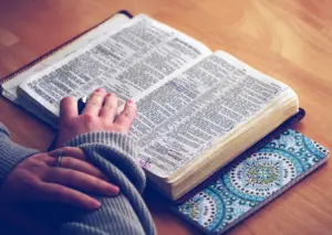 Woman reading bible table