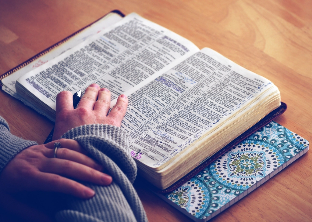 Woman reading bible table