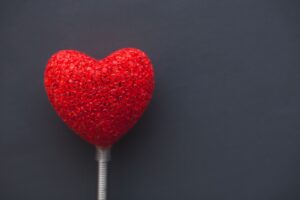 big red heart on dark background